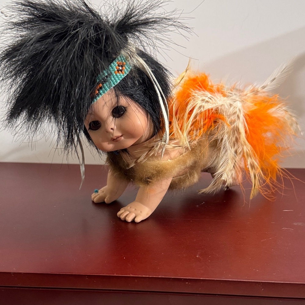 Highly Collectable Native American Crawling Baby Porcelain Doll with Feathers